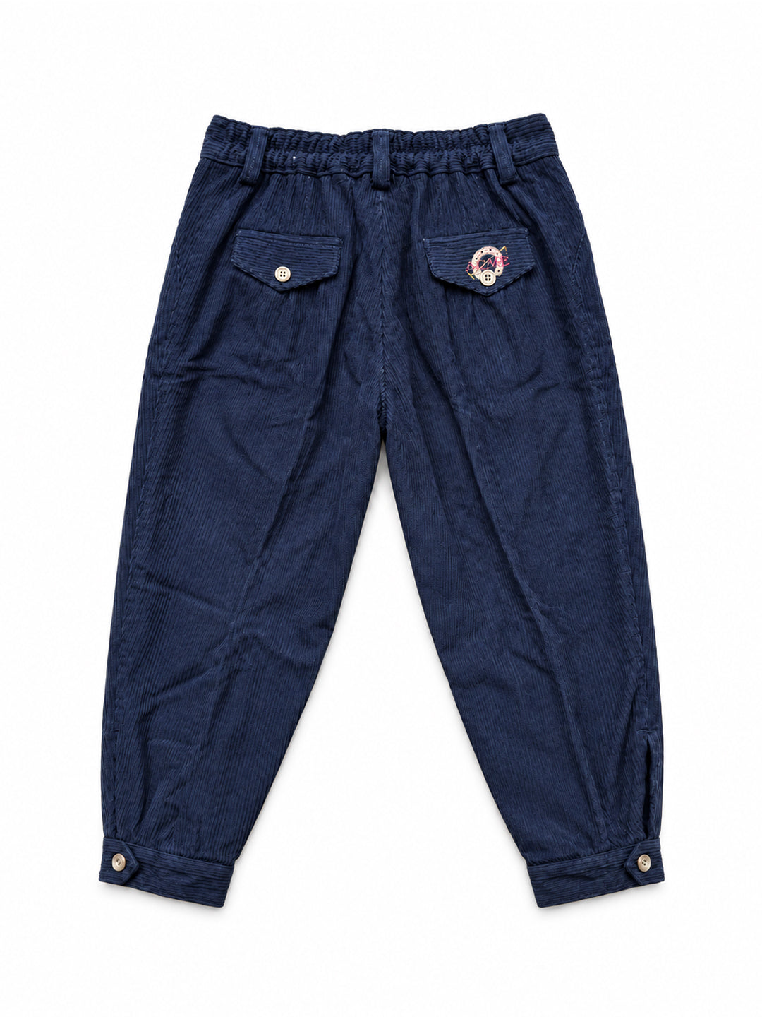 A pair of dark navy blue corduroy pants with an elastic waistband, side pockets, and buttoned cuffs, shown flat on a white background. Argentine Bombacha Pants, horseback riding, traditional gaucho, Argentine cowboy attire. Soft and breathable fabrics, perfect pants for all-day wear. With a loose fit and elasticated waistband, they allow for plenty of movement, while the high waist provides extra coverage. Everyday look, perfect for both urban and countryside adventures. Cotton Corduroy, KIDS, PANTS, KIDSWE