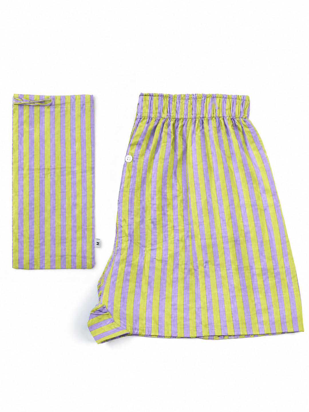 A pair of striped linen pajama pants in yellow and purple, shown flat-laid with one piece folded to display the pocket detail. ETHICAL FASHION, CRAFTSMANSHIP, SUSTAINABLE FASHION, TRADITIONAL FASHION, ETHNIC FASHION, BOHEMIAN FASHION, MODA ETICA, MODA SOSTENIBILE, TECNICHE ARTIGIANALI, MODA TRADIZIONALE, MODA ETNICA, BOHEMIAN DRESS, MADE IN INDIA, HANDMADE IN INDIA, BLOCK PRINT, FLOWER SWIMWEAR, COSTUMI A FIORI, COSTUME DI COTONE, COTTON SWIMWEAR, ETNIC PRINTS, STAMPE INDIANE, STAMPE ETNICHE, COSTUME DA UOM