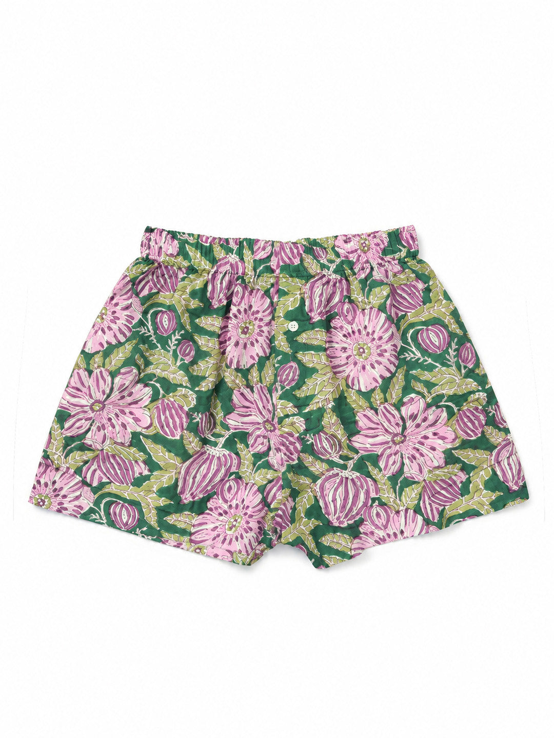 A pair of women's shorts featuring a vibrant green base with a bold pink and purple floral print, laid flat against a solid white background. ETHICAL FASHION, CRAFTSMANSHIP, SUSTAINABLE FASHION, TRADITIONAL FASHION, ETHNIC FASHION, BOHEMIAN FASHION, MODA ETICA, MODA SOSTENIBILE, TECNICHE ARTIGIANALI, MODA TRADIZIONALE, MODA ETNICA, BOHEMIAN DRESS, MADE IN INDIA, HANDMADE IN INDIA, BLOCK PRINT, FLOWER SWIMWEAR, COSTUMI A FIORI, COSTUME DI COTONE, COTTON SWIMWEAR, ETNIC PRINTS, STAMPE INDIANE, STAMPE ETNICHE,
