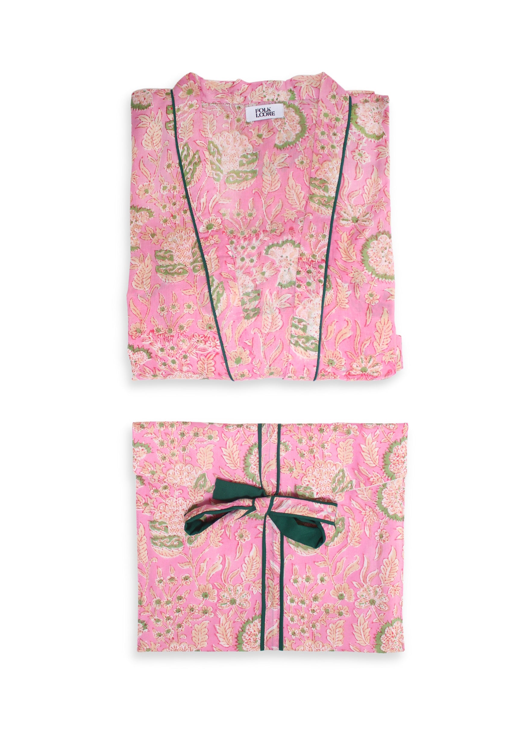 Unique cotton block-printed dressing gown, handmade in India by the local artisans. Refined with a belt and pockets, pack your nightgown for an exotic trip or wear it in the comfort of your own city home at winter time! DETAILS AND CARE Pink and green pattern with green piping 100% cotton Hand wash with cold water and mild detergent Do not soak Dry in the shade, direct sunlight can fade color As all handmade prints, there may be a small amount of residual color in the fabric ONE SIZE
